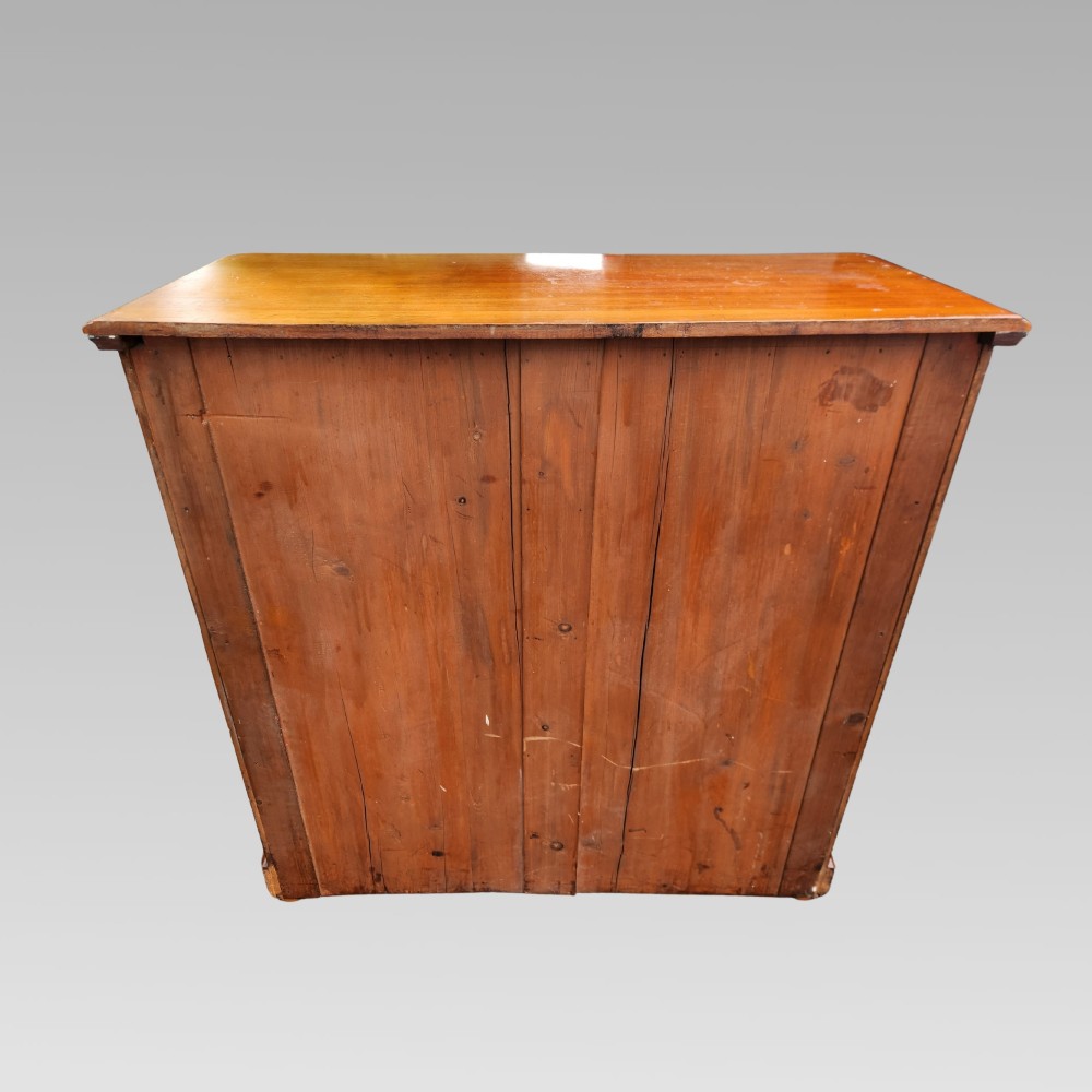 A Victorian mahogany chest of drawers featuring two short drawers above three full-width graduated drawers with turned wooden handles and a plinth base. View VII