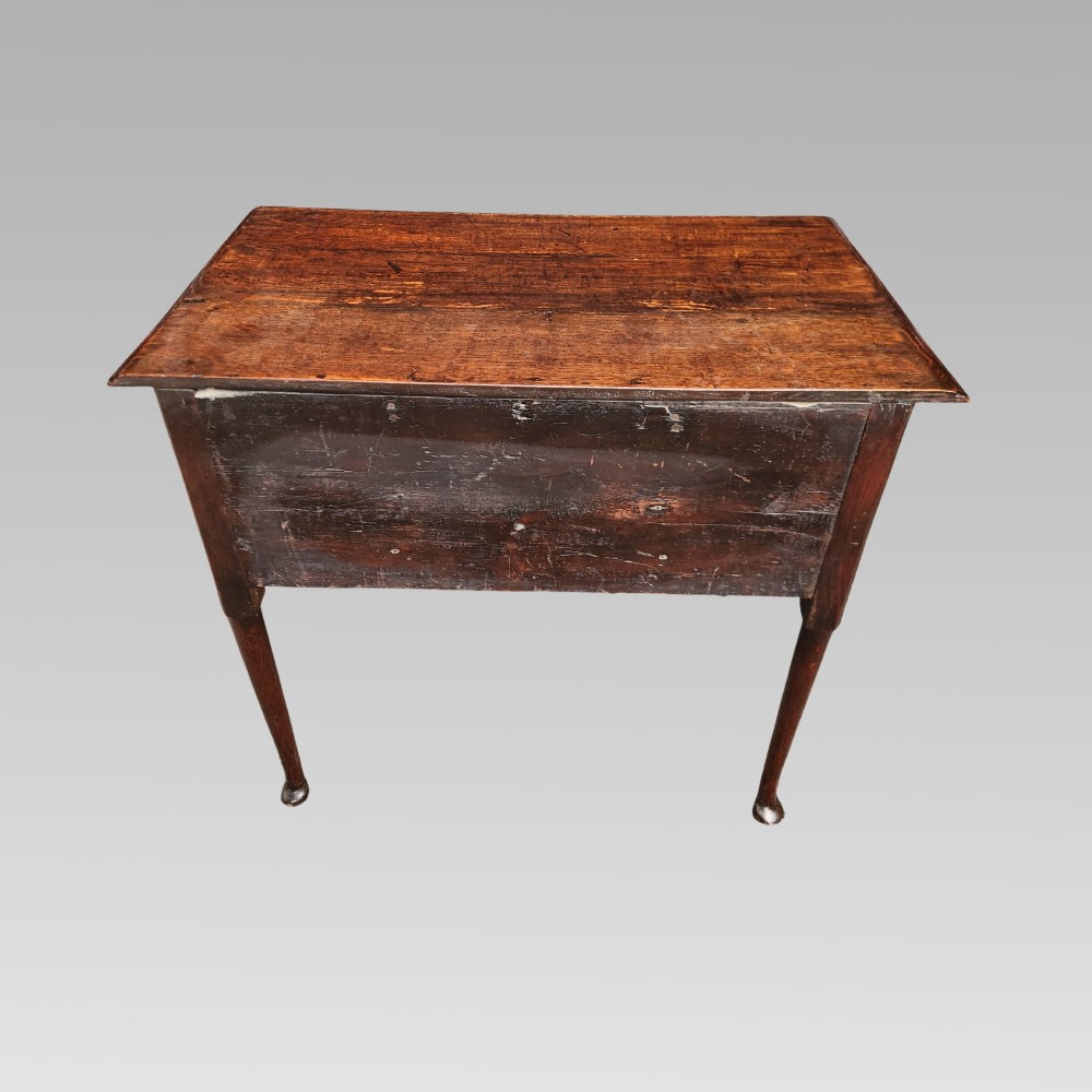 An antique Georgian oak lowboy side table featuring three front drawers with brass handles, a shaped apron, and four slender cabriole legs. View VIII