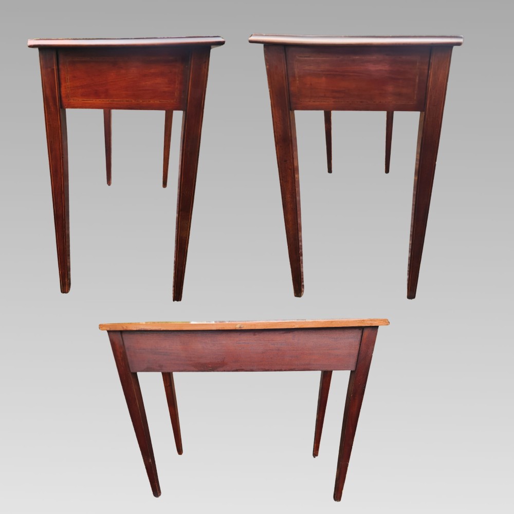 A Victorian mahogany side table featuring decorative satinwood geometric inlay on the rectangular top, two drawers with wooden knobs, and four tapered legs. View III