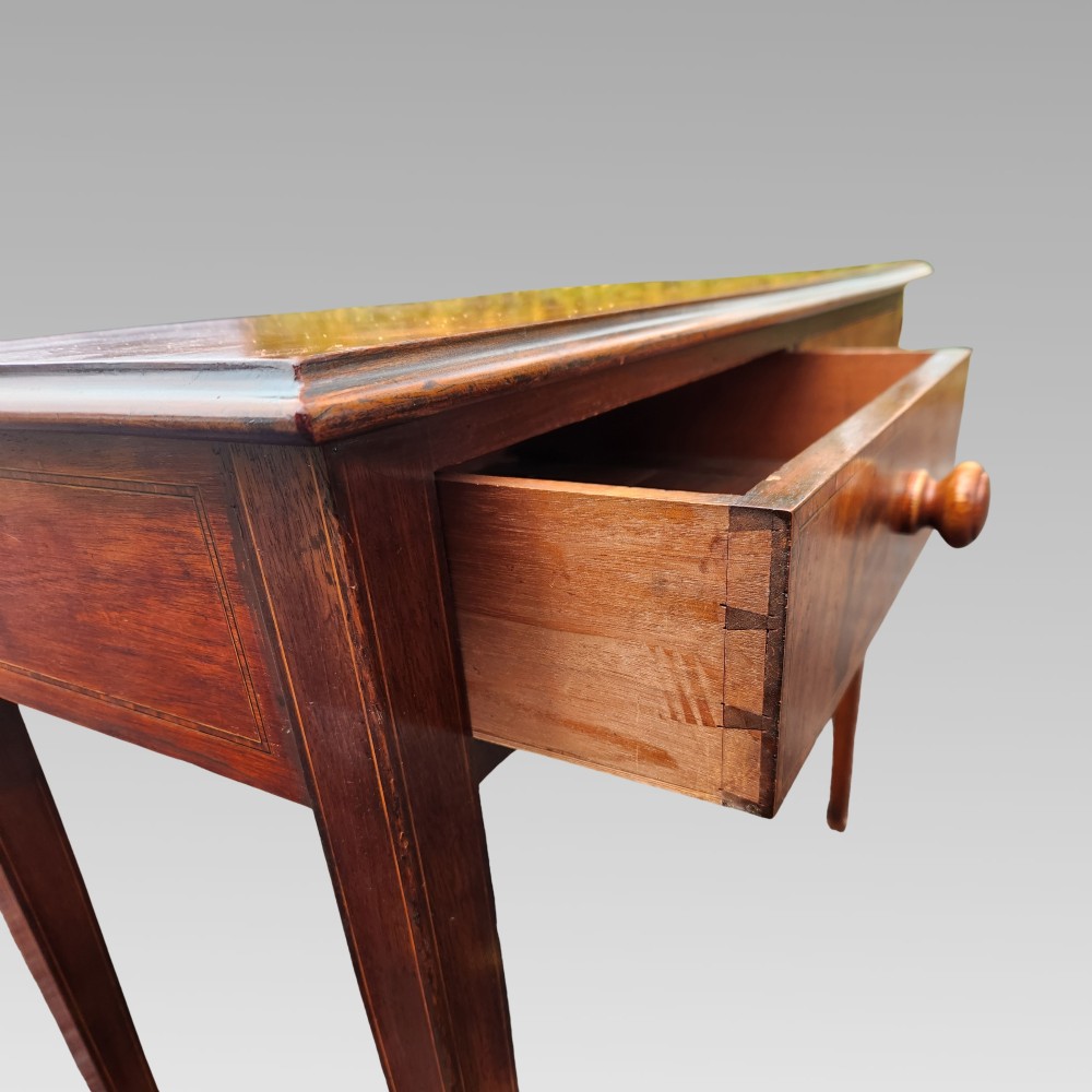 A Victorian mahogany side table featuring decorative satinwood geometric inlay on the rectangular top, two drawers with wooden knobs, and four tapered legs. View IV
