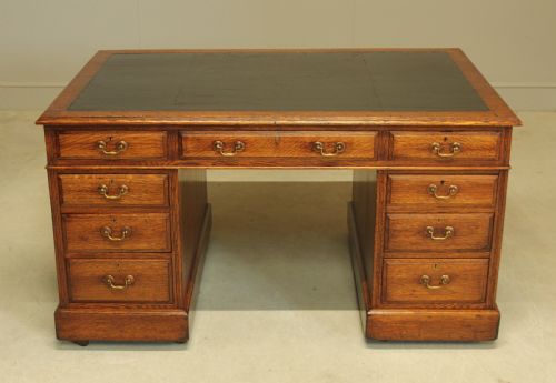 AN EARLY 20THCENTURY OAK PARTNER'S DESK - ADDITIONAL PHOTO 2
