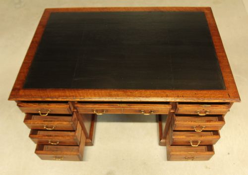 AN EARLY 20THCENTURY OAK PARTNER'S DESK - ADDITIONAL PHOTO 8