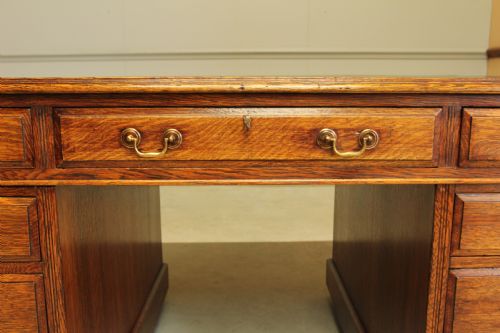 AN EARLY 20THCENTURY OAK PARTNER'S DESK - ADDITIONAL PHOTO 9