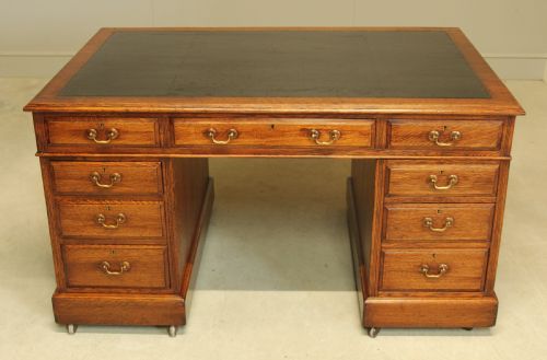AN EARLY 20THCENTURY OAK PARTNER'S DESK - ADDITIONAL PHOTO 10