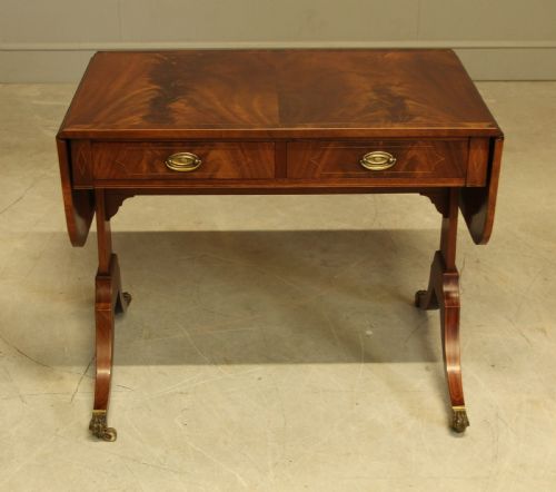 fig 1. A 19th century curl mahogany sofa table