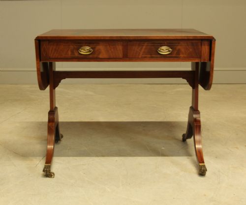 fig 2. A 19th century curl mahogany sofa table