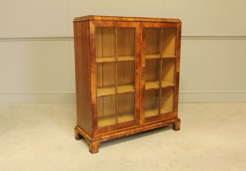 An Early 20th Walnut Display Bookcase.