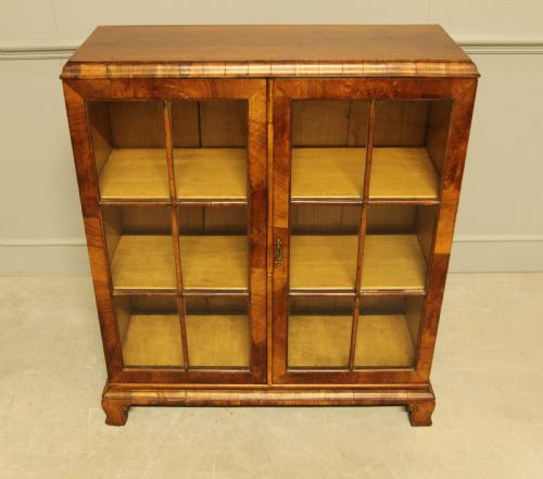 fig 2. AN EARLY 20TH WALNUT DISPLAY BOOKCASE.