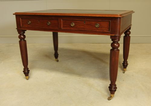 fig 2. A Victorian mahogany writing table.