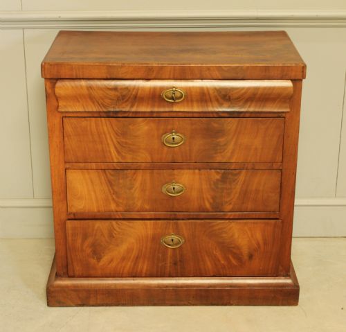 fig 1. A Curl mahogany 19th-century Swedish late Empire chest of drawers.