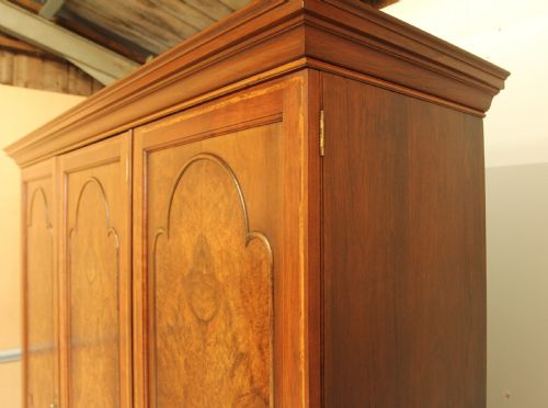 fig 2. AN EARLY 20TH CENTURY BURR WALNUT TRIPLE WARDROBE