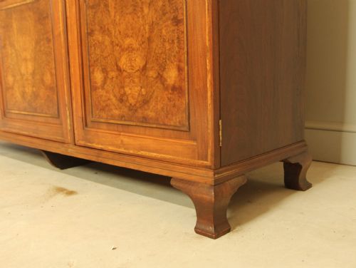fig 3. AN EARLY 20TH CENTURY BURR WALNUT TRIPLE WARDROBE