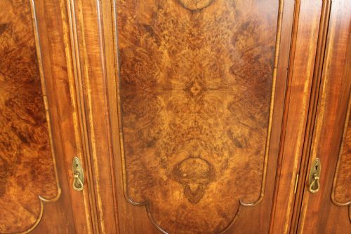 fig 4. AN EARLY 20TH CENTURY BURR WALNUT TRIPLE WARDROBE