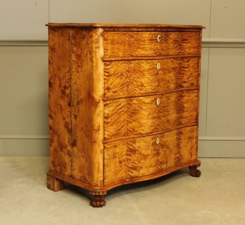 A 19th Century Swedish Serpentine Chest of Drawers.