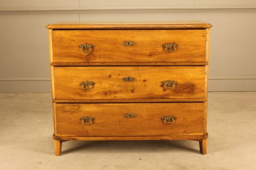 fig 1. A 19th-century Swedish oak secretaire chest featuring an open hinged fall-front writing flap revealing fitted interior drawers, positioned above two large lower drawers.