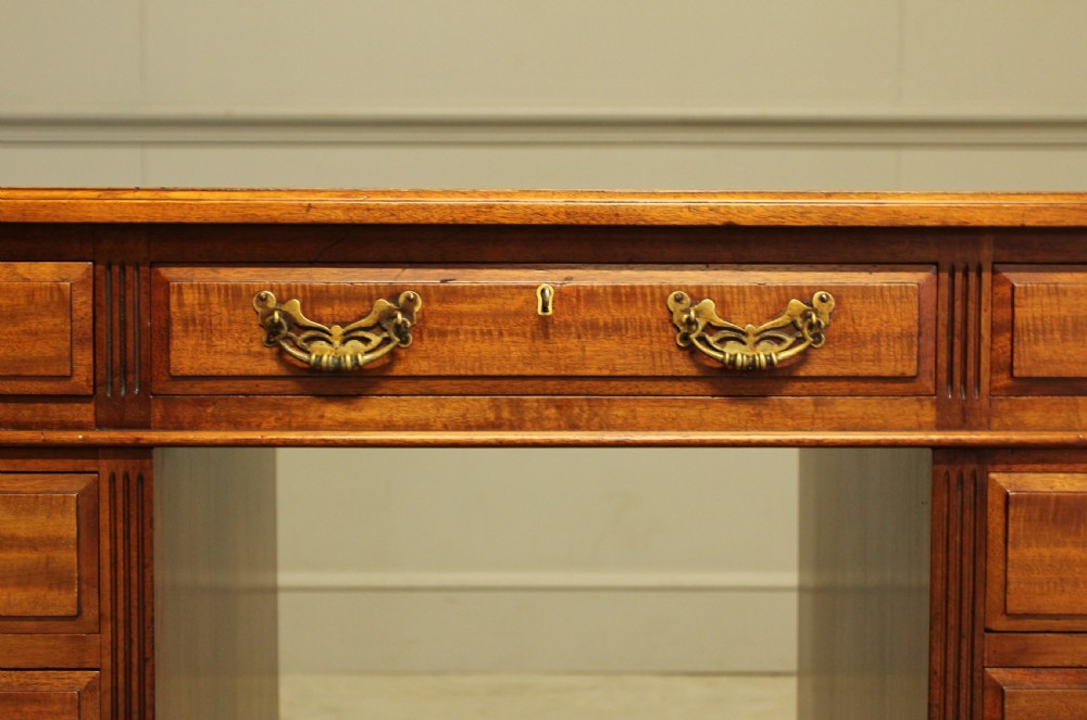 An early 20th century mahogany writing desk. View IX