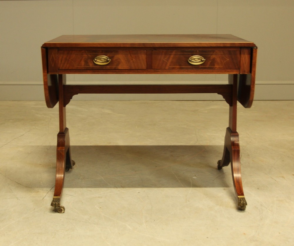 A 19th century curl mahogany sofa table View III