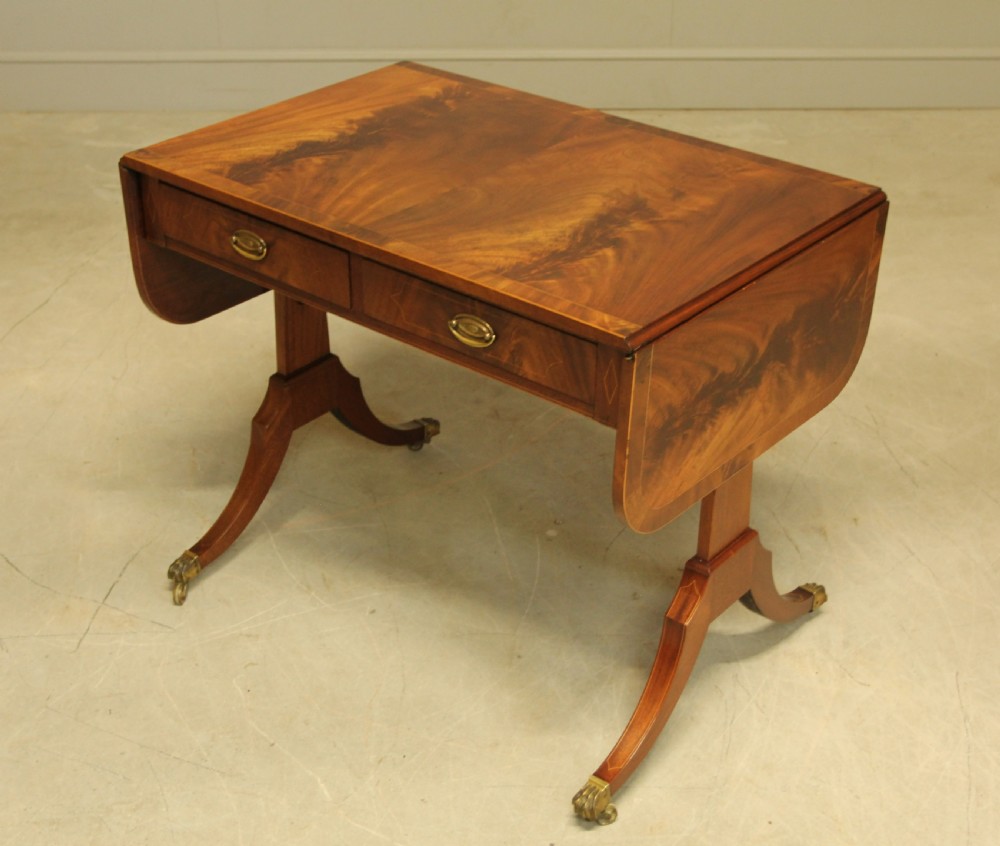 A 19th century curl mahogany sofa table View V