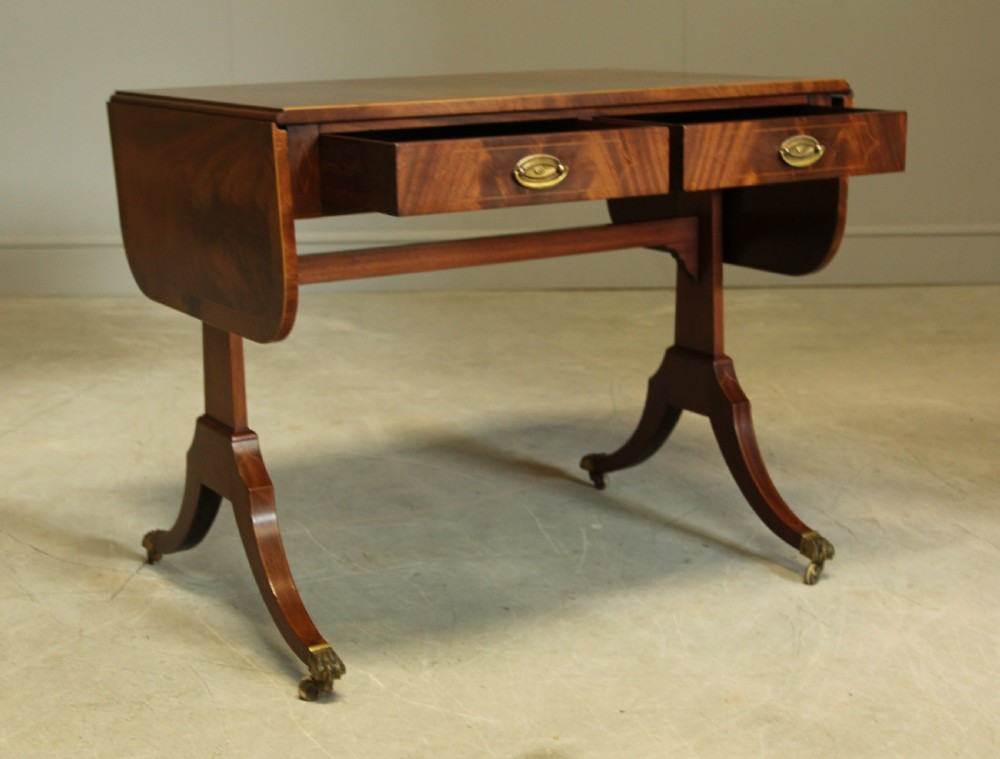 A 19th century curl mahogany sofa table View VIII