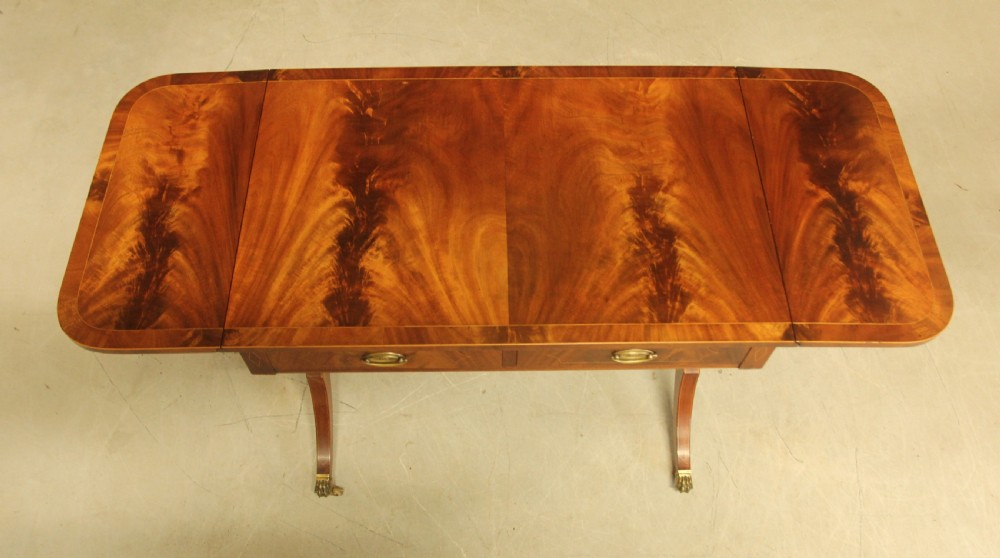 A 19th century curl mahogany sofa table View IX