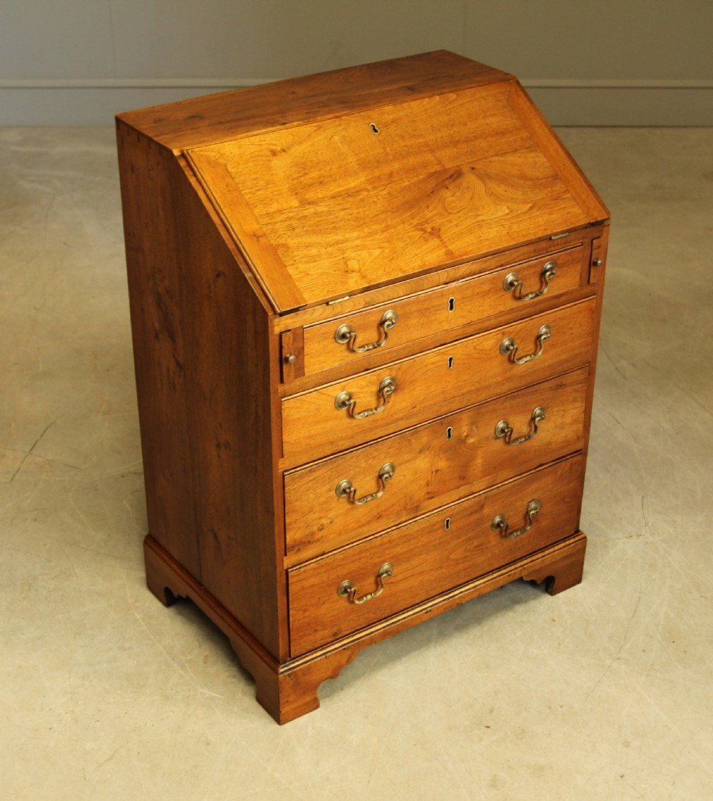 A SMALL 18TH CENTURY CHESTNUT BUREAU.  View IV