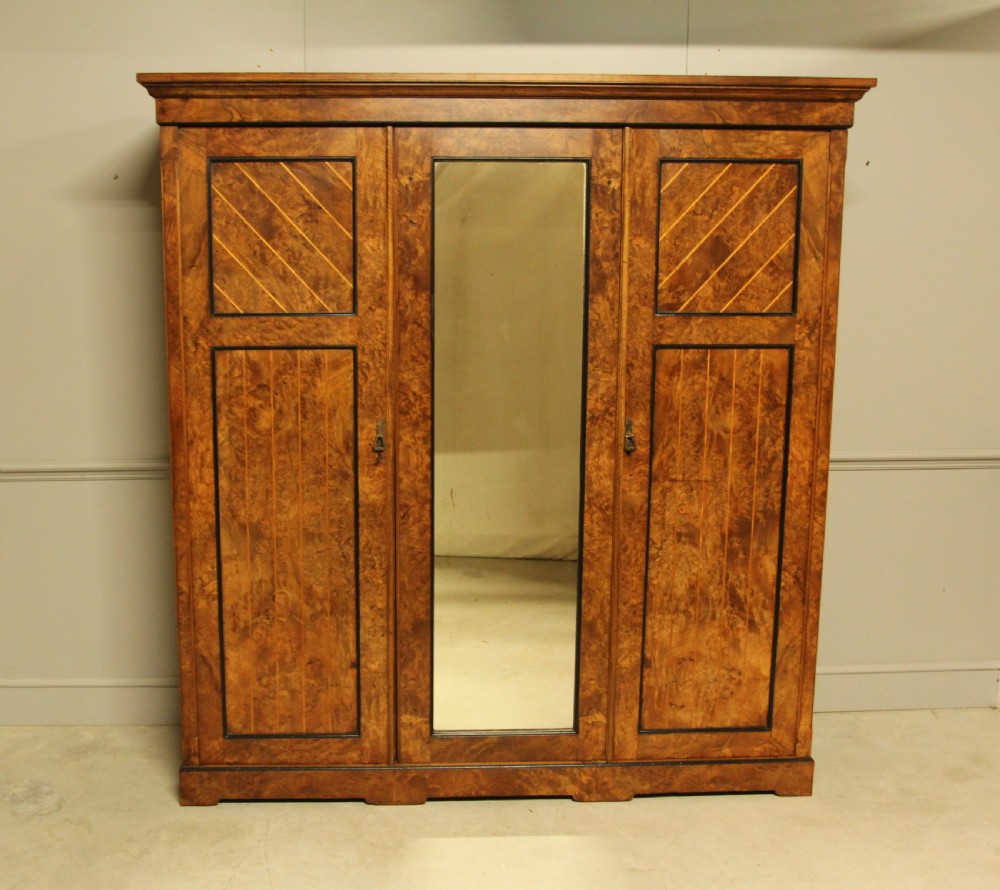 A VICTORIAN BURR WALNUT WARDROBE TRIPLE MIRRORED COMPACTUM.