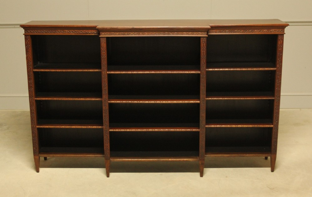 A early 20th century mahogany breakfront open bookcase. 
