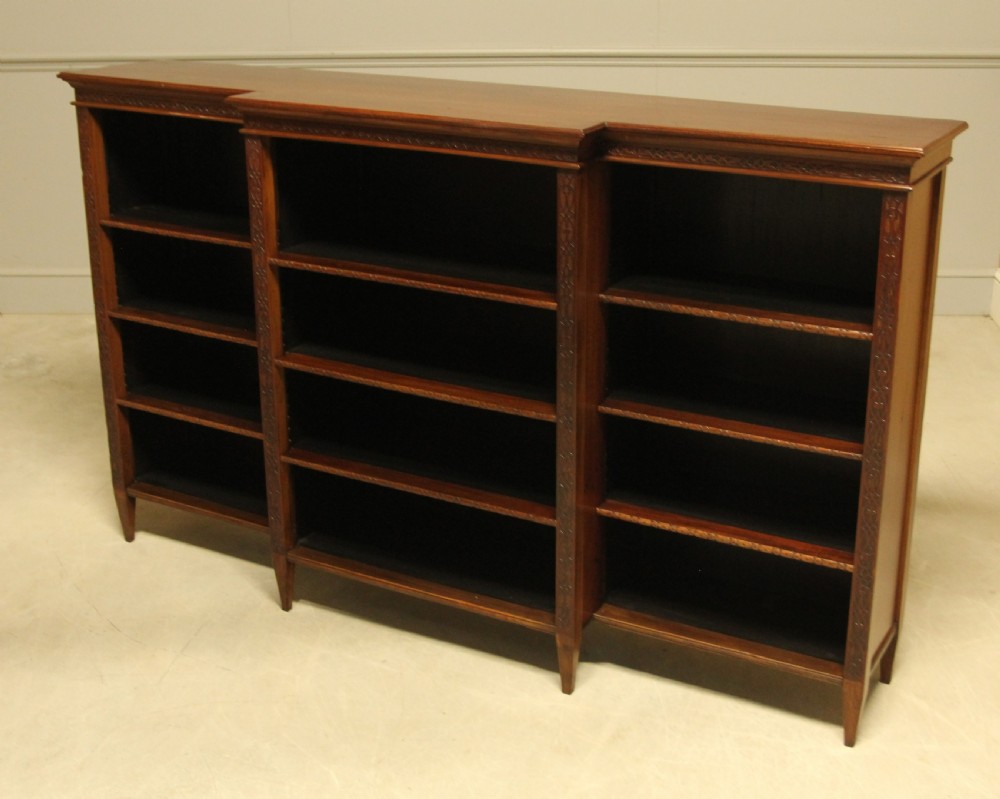 A early 20th century mahogany breakfront open bookcase.  View IV