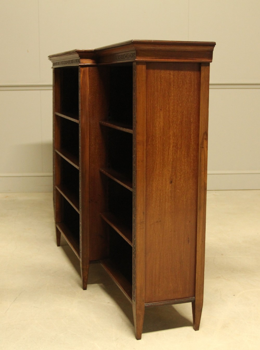 A early 20th century mahogany breakfront open bookcase.  View VII