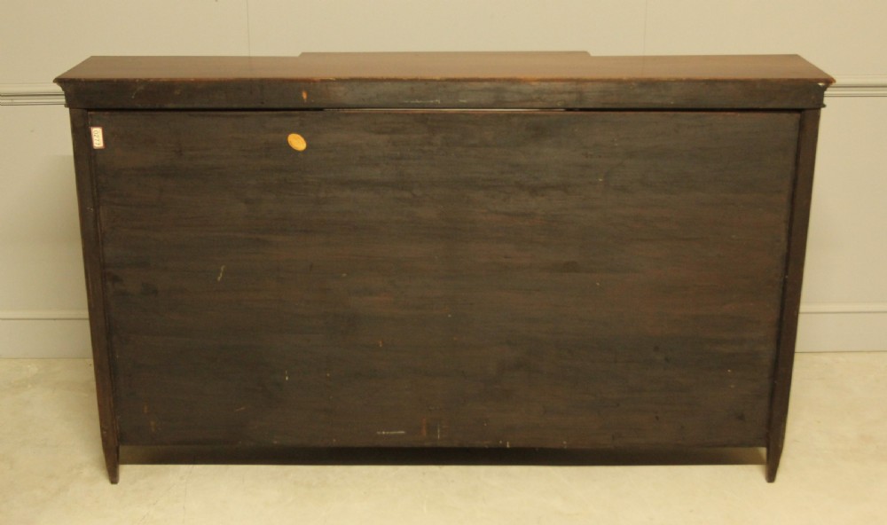 A early 20th century mahogany breakfront open bookcase.  View IX