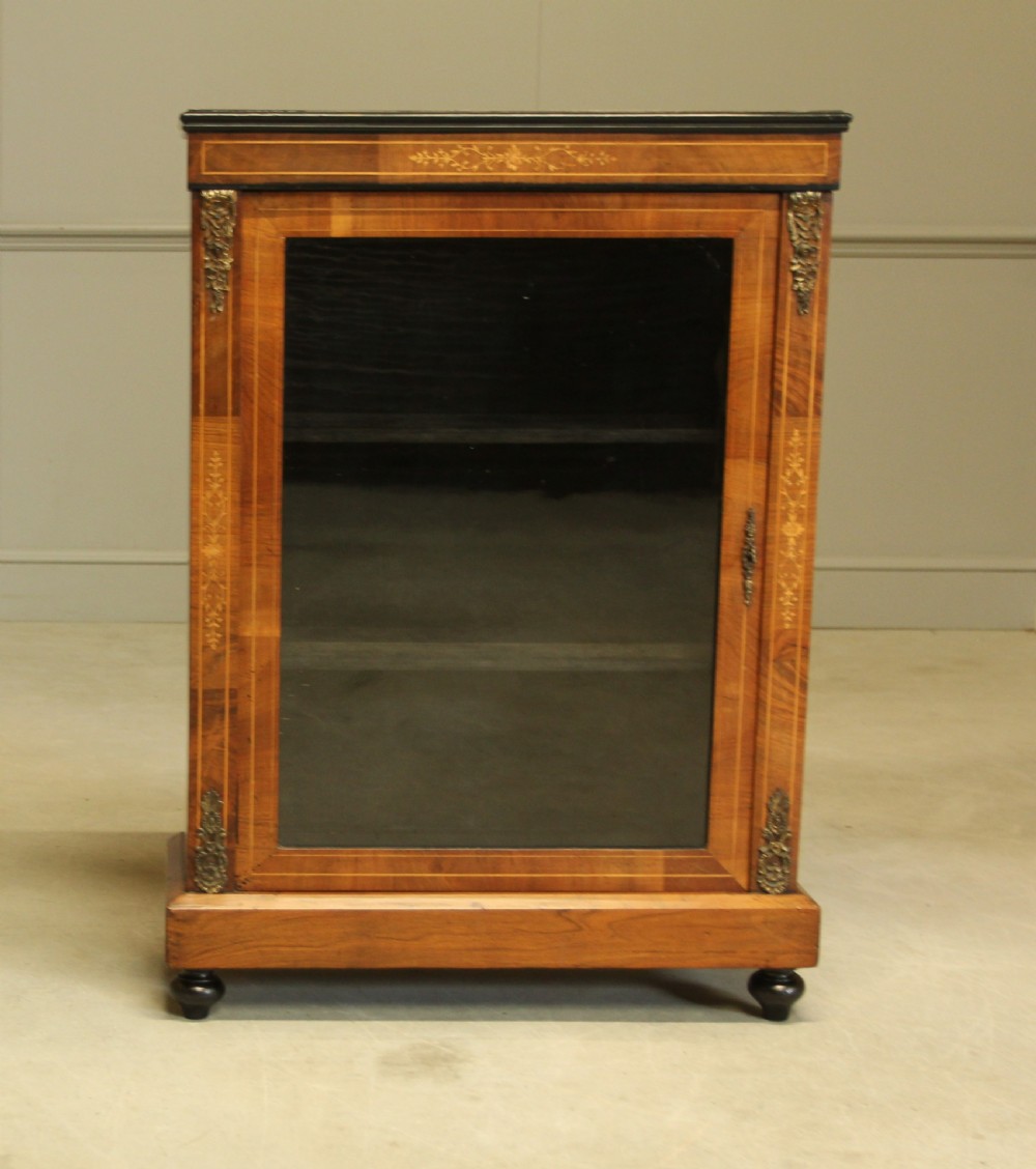 A Victorian Walnut pier display cabinet.