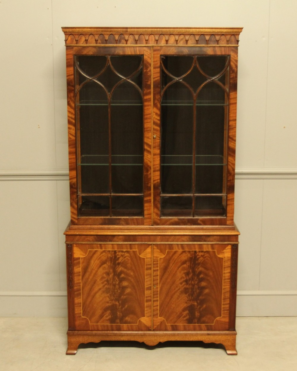 An early 20th-century mahogany glazed display cabinet.