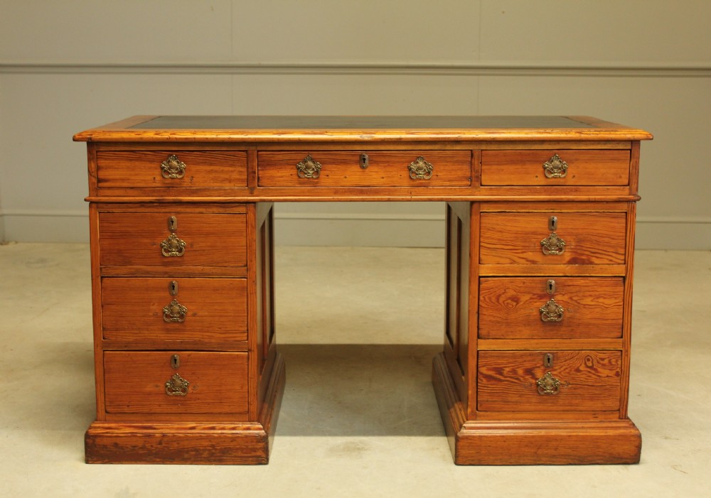 A Victorian Pitch Pine twin pedestal writing desk.