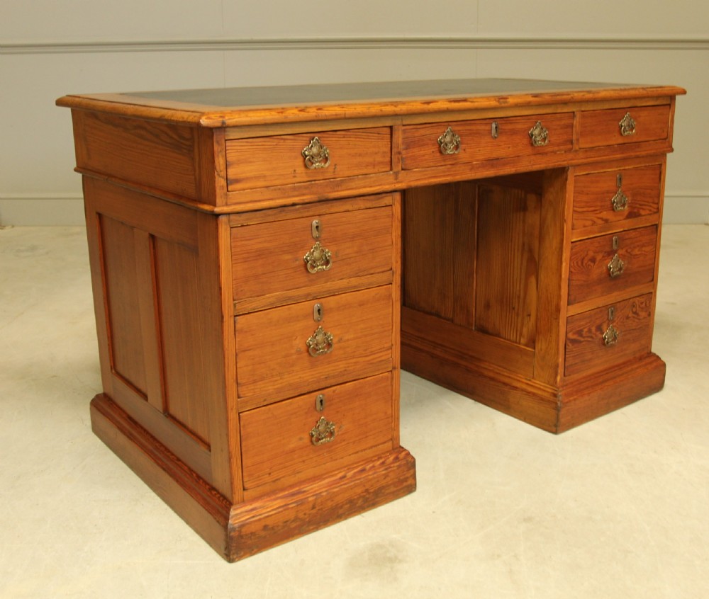 A Victorian Pitch Pine twin pedestal writing desk. View IV