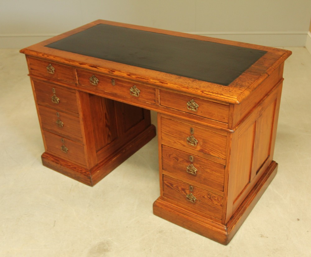 A Victorian Pitch Pine twin pedestal writing desk. View VII