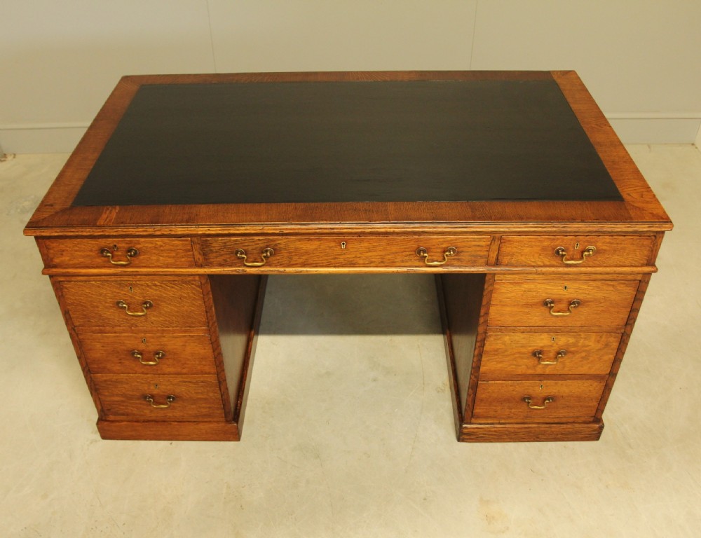 A LARGE EARLY 20TH CENTURY OAK TWIN PEDESTAL DESK  View III