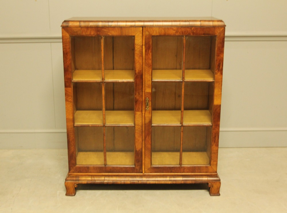 AN EARLY 20TH WALNUT DISPLAY BOOKCASE. View II