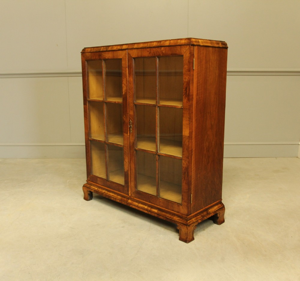 AN EARLY 20TH WALNUT DISPLAY BOOKCASE. View VII