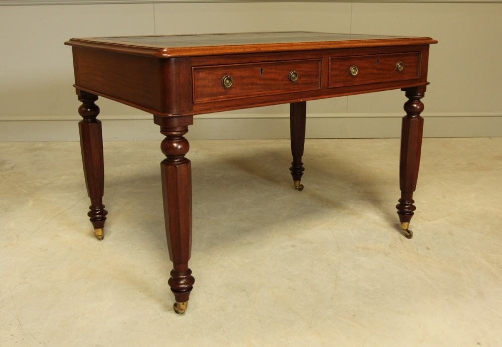 A Victorian mahogany writing table.  View II