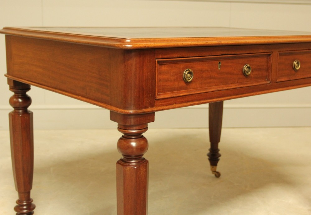 A Victorian mahogany writing table.  View IV