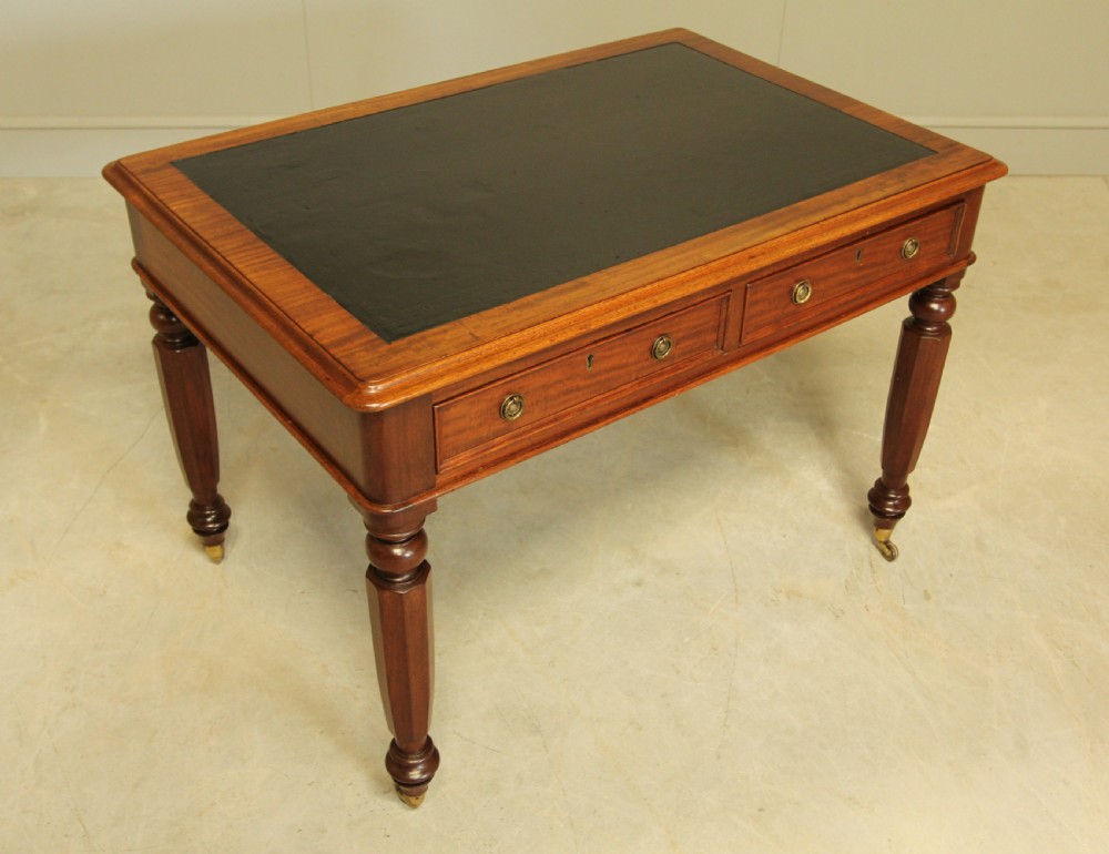 A Victorian mahogany writing table.  View VII