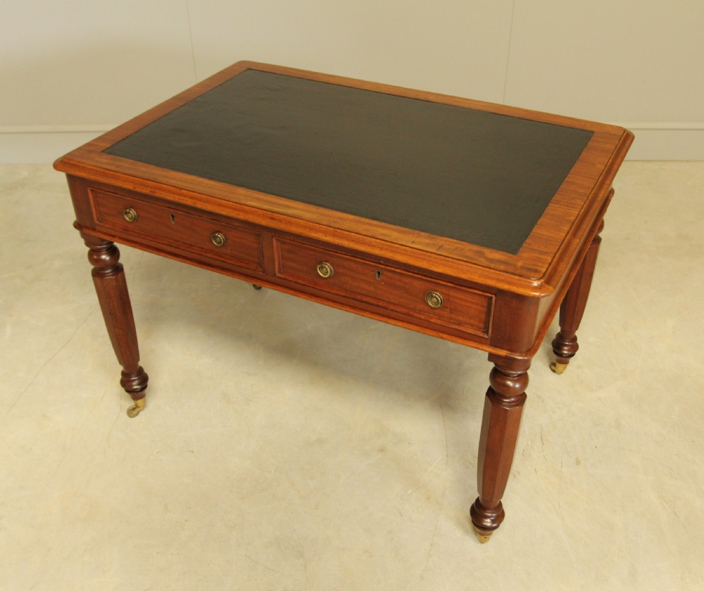 A Victorian mahogany writing table.  View VIII