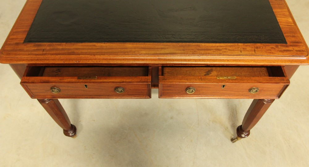 A Victorian mahogany writing table.  View IX