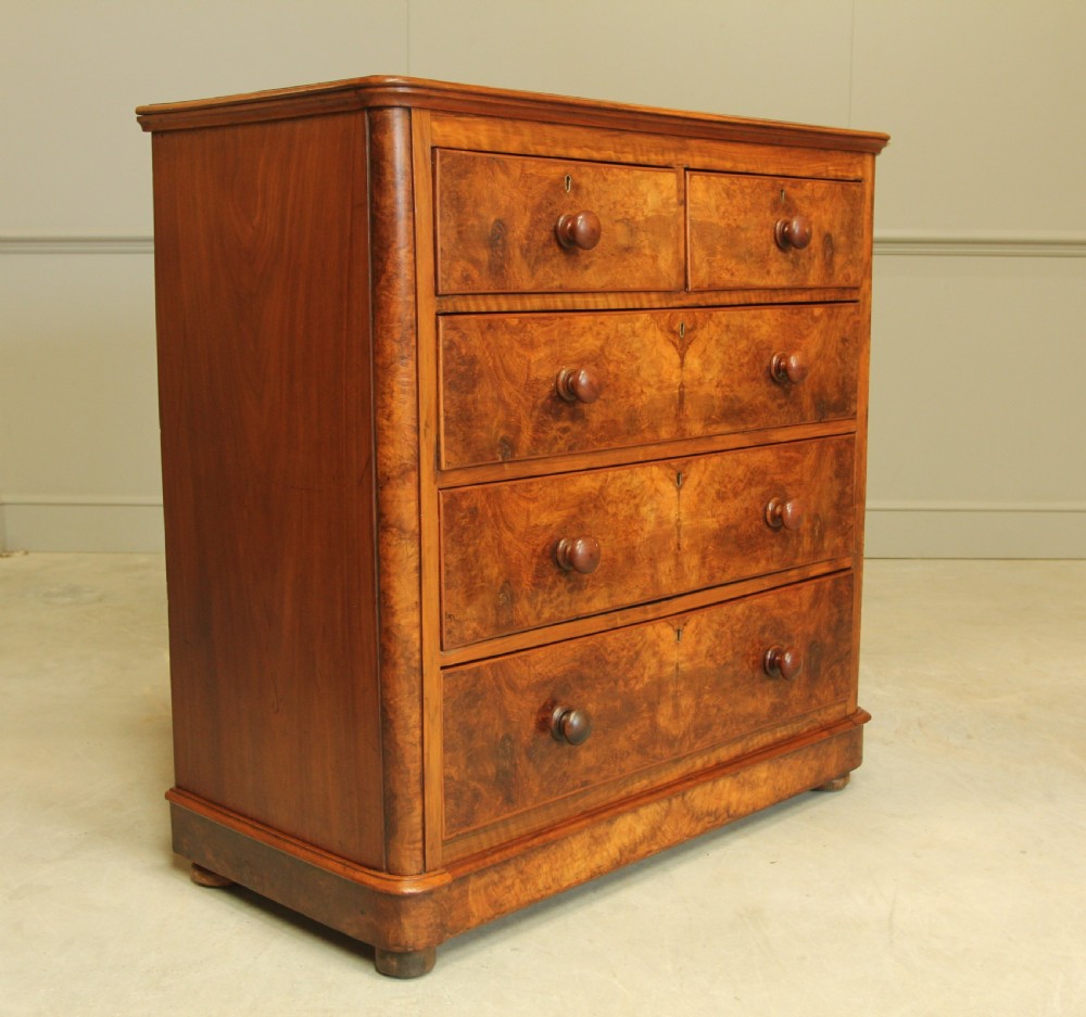 A VICTORIAN BURR WALNUT CHEST OF DRAWERS View III