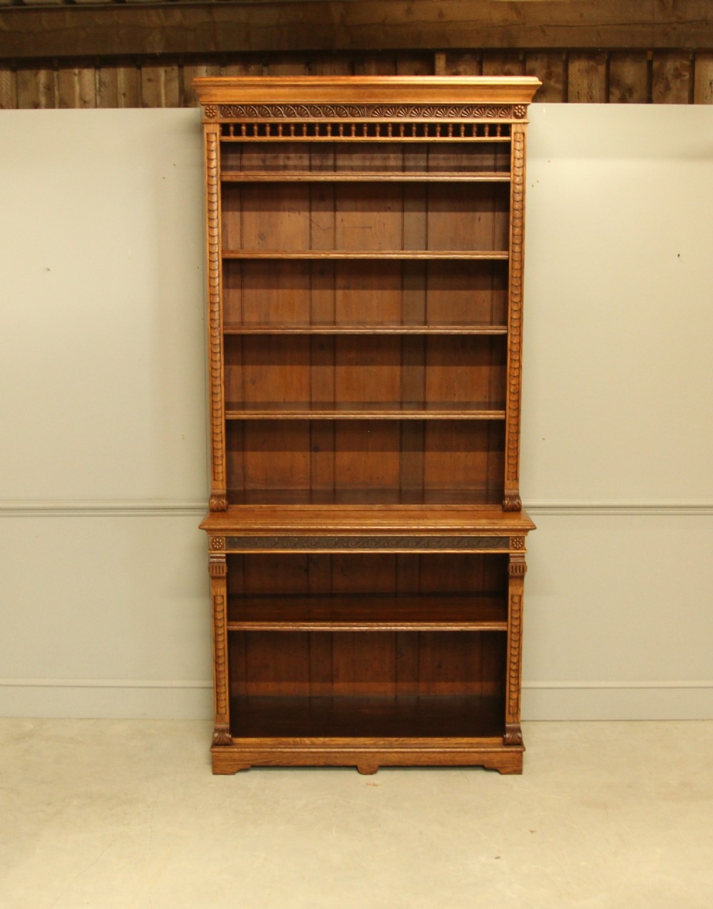 A VICTORIAN AESTHETIC OAK OPEN BOOKCASE.