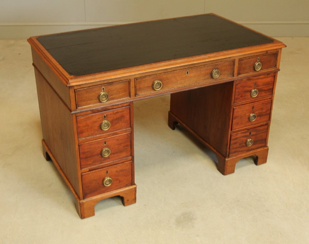 A GEORGIAN MAHOGANY TWIN PEDESTAL DESK