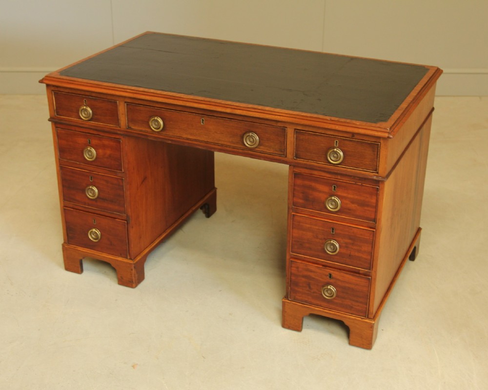 A GEORGIAN MAHOGANY TWIN PEDESTAL DESK View X