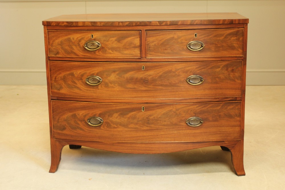 A REGENCY MAHOGANY BOW FRONTED CHEST OF DRAWERS. View III