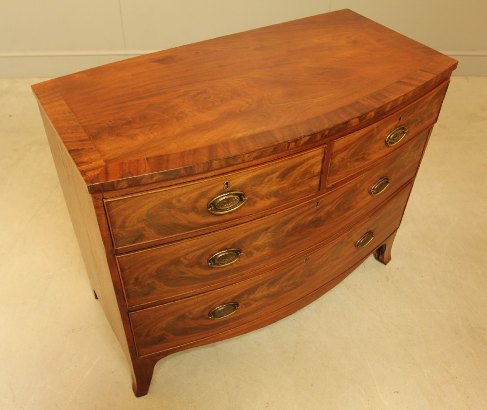 A REGENCY MAHOGANY BOW FRONTED CHEST OF DRAWERS. View IX