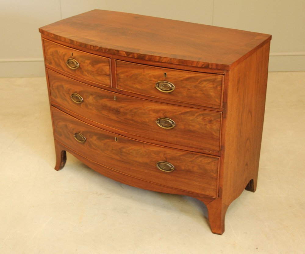 A REGENCY MAHOGANY BOW FRONTED CHEST OF DRAWERS. View X